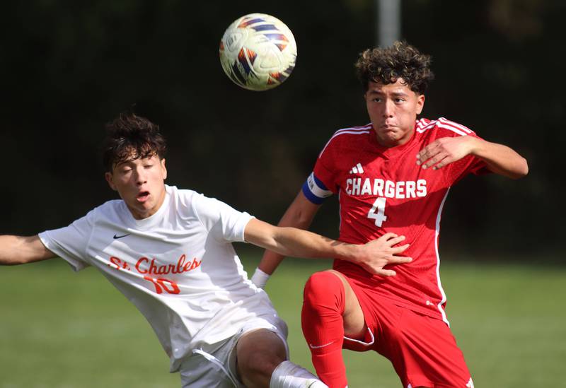 Dundee-Crown’s Angel Landeros, right, battles St. Charles East’s Huxley Kapoor in IHSA Class 3A Regional Championship soccer at Dundee-Crown High School in Carpentersville on Saturday, October 25, 2025.