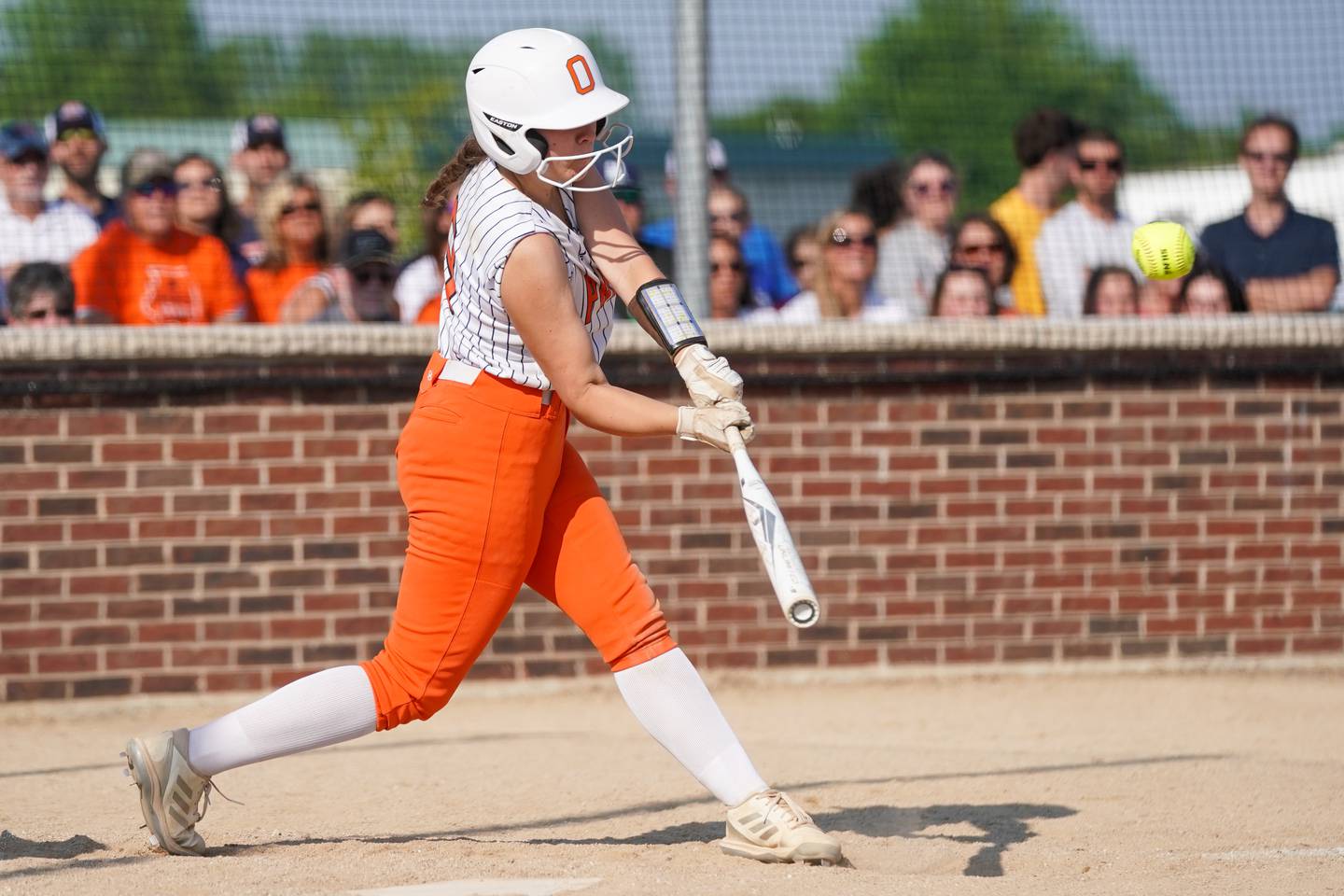 Oswego’s Kennedy Gengler (9) slaps a two run double against Wheaton North during a Class 4A Oswego Sectional Final game at Oswego High School on Friday, June 6, 2025.
