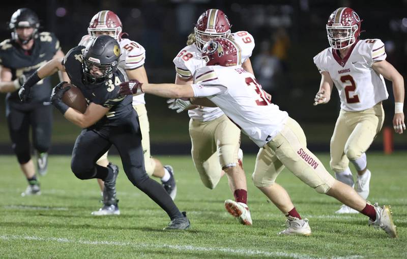 Sycamore's Joey Puleo gets by Morris' Jacob Swartz during their game Friday, Oct. 21, 2022, at Sycamore High School.