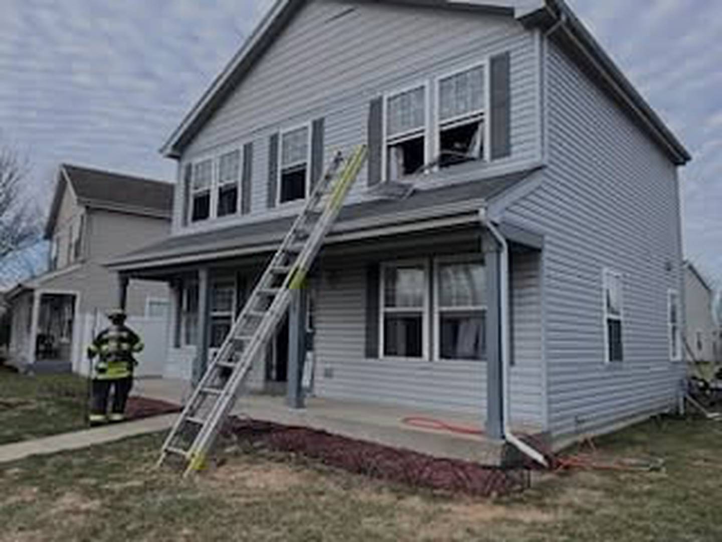 Lockport Township firefighters outside the Crest Hill home where a fire broke out in the morning of Tuesday, March 18, 2025.