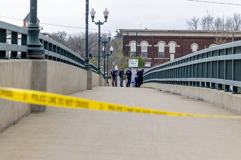 Police tape off the west side bridge sidewalk on Peoria Ave. in Dixon Tuesday, April 14, 2026, after an individual jumped over the railing off of the Peoria Avenue Bridge late Monday night.