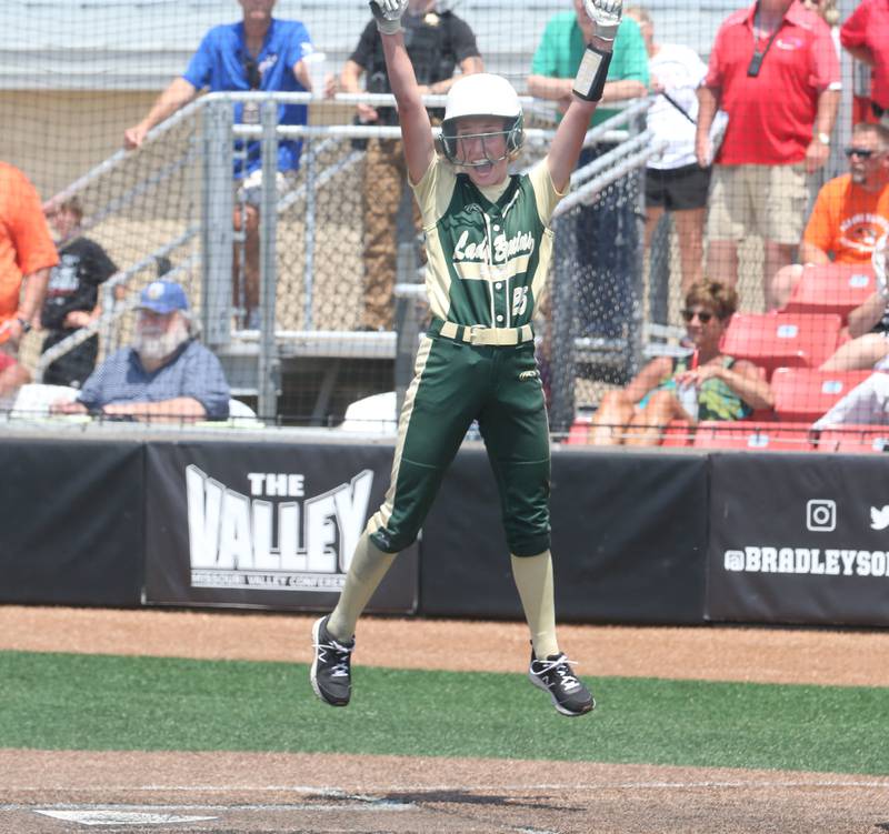 St. Bede's Emma Slingsby leaps in the air with excitement after scoring a run against Illini Bluffs in the Class 1A State championship game on Saturday, June 3, 2023 at the Louisville Slugger Sports Complex in Peoria.