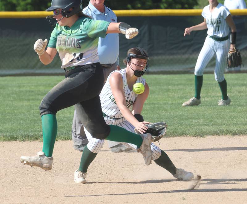 St. Bede's Morgan Mercer knocks the ball down as Dwight's Sarah Parker eyes second base on Friday, May 15, 2026 at St. Bede Academy.