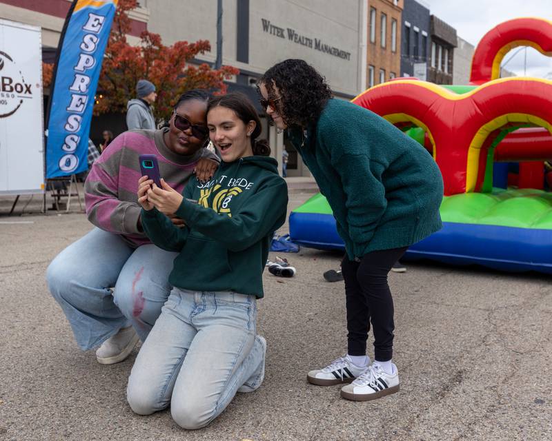 (from left) Maliya Massamba, Jemma Finley and Jyllian Pozzi pose for selfie at Frosty on First on Saturday, November 8, 2025 on First Street in La Salle.
