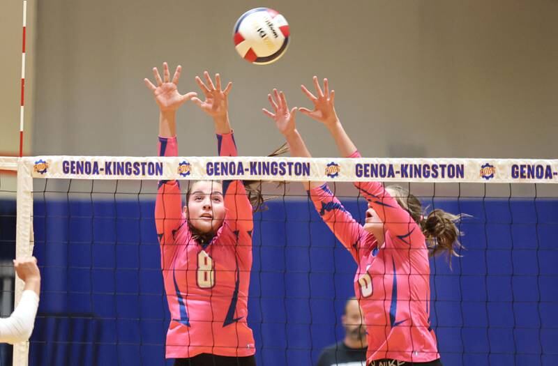 Genoa-Kingston's Alivia Keegan (left) and Kaitlin Rahn go up for a block during their Volley for the Cure match against Oregon Wednesday, Sept. 21, 2022, at Genoa-Kingston High School.