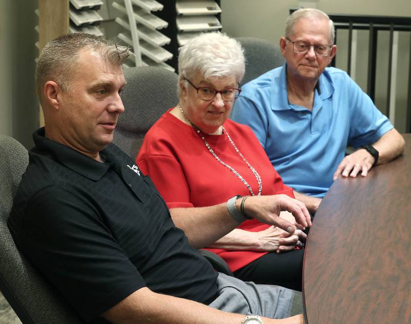 Greg Spears, (left) Ken Spears Construction president, talks about his company with his parents and company founders, Ken and Kathy Spears looking on Friday, Aug 22, 2025, at the business in DeKalb. The company is celebrating its 50th anniversary this year.