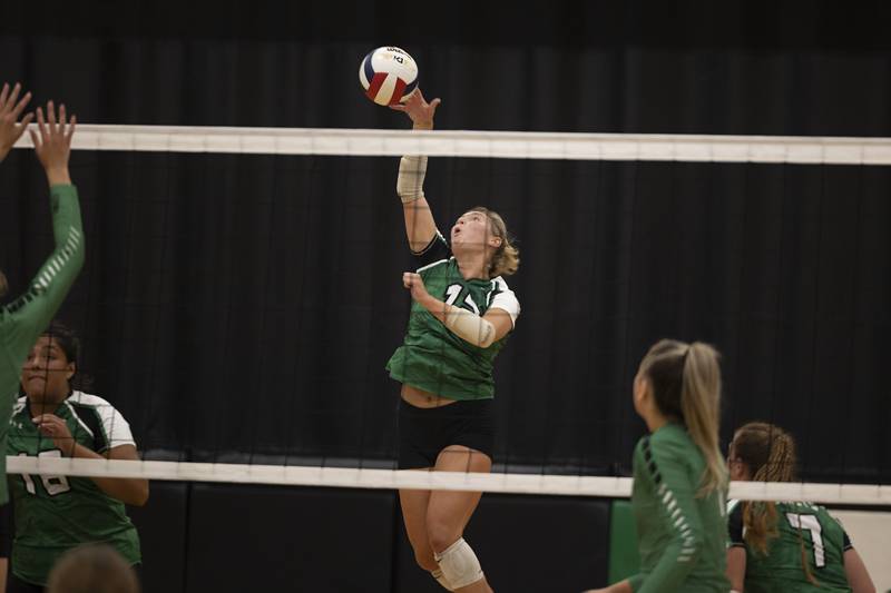 Rock Falls’ Claire Bickett spikes the ball against Geneseo Tuesday, August 22, 2023.