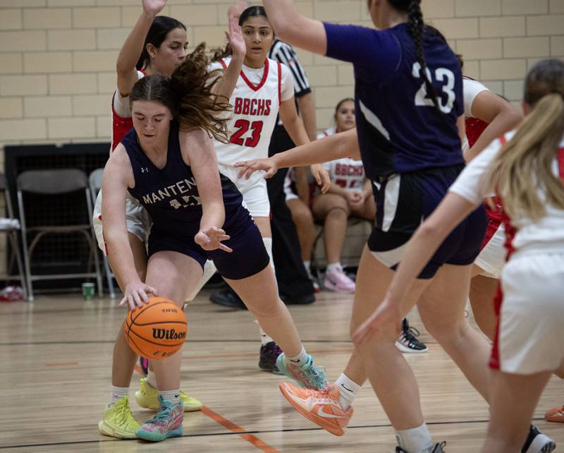 Manteno's Emily Horath, left, runs into Bradley-Bourbonnais's Abby Bonilla while trying to make a drive to the net in the Beecher Fall Classic on Tuesday, November 18, 2025.