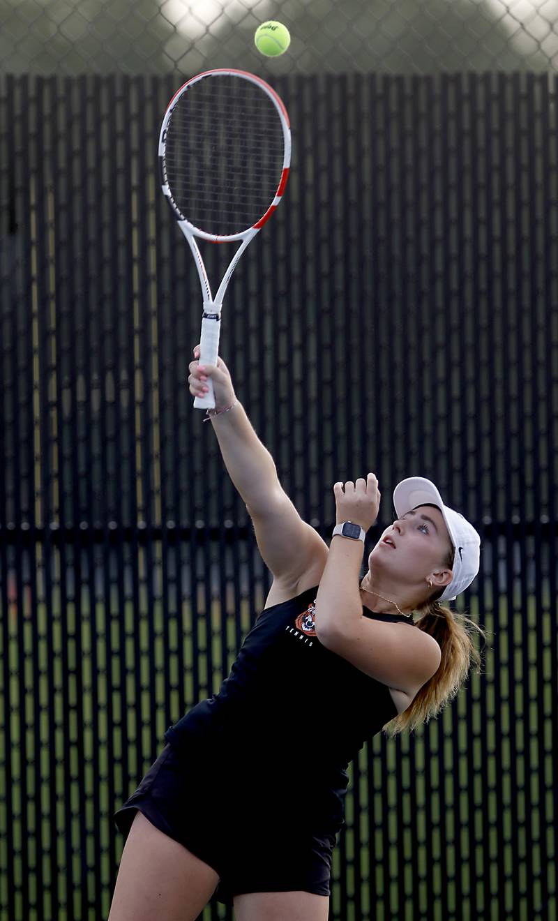 Crystal Lake Central’s Kaylen Kaczmarek serves the the ball during a Fox Valley Conference tennis match on Monday, Sept. 25, 2023, at Crystal Lake Central High School.