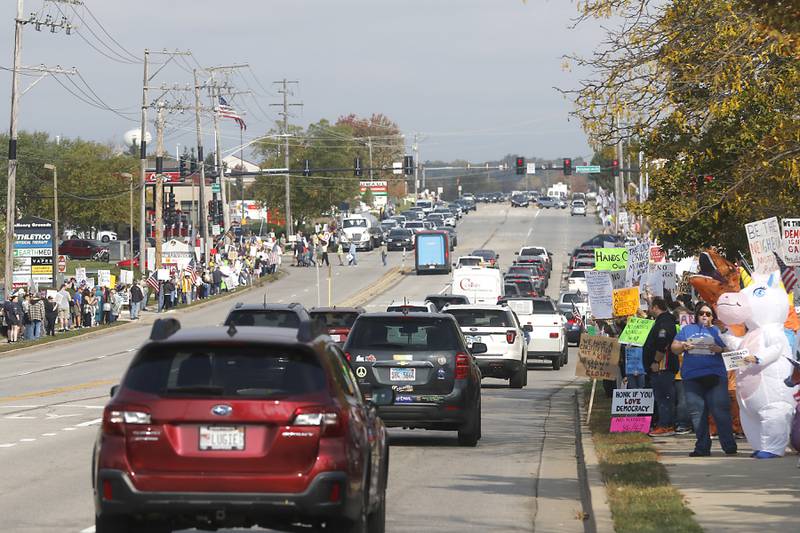 Protesters line Route 31 during a "No Kings” protest rally on Saturday, Oct. 18, 2025, in McHenry. The protest drew thousands of protesters to the area to protest the policies of President Donald Trump.