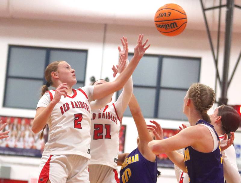 Huntley’s Avery Suess battles others for the ball against Hononegah in girls basketball at Dundee-Crown High School in Carpentersville on Tuesday, November 25, 2025.
