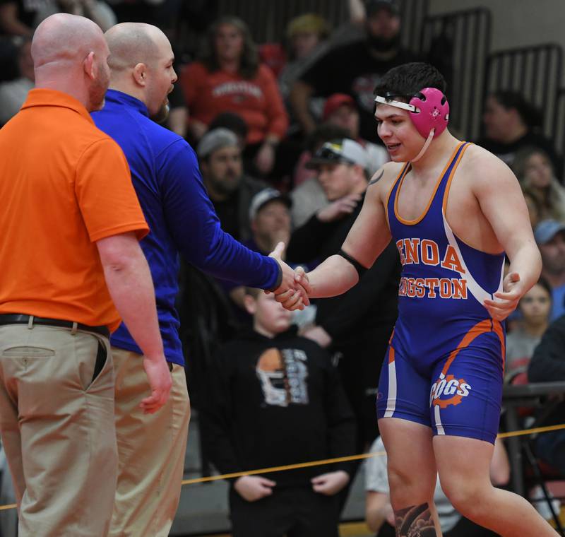 Genoa Kingston's Julian Torres gets a handshake from his coach after winning his consolation semifinal at 195 pounds at the 1A Oregon Wrestling Sectional on Saturday.