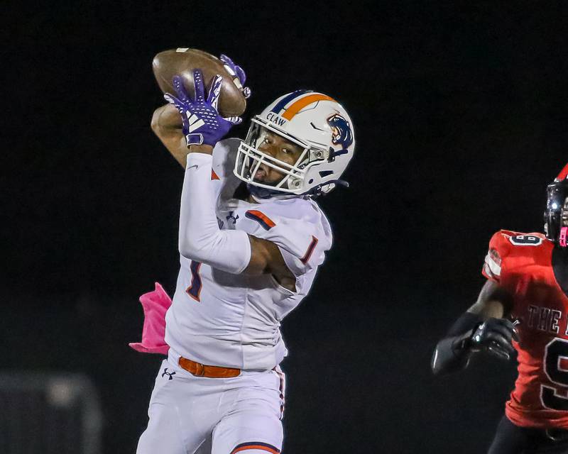 Oswego's Jeremiah Cain (1) makes a catch during a football game between Oswego at Bolingbrook on Friday, Oct 4th, 2024  in Bolingbrook.