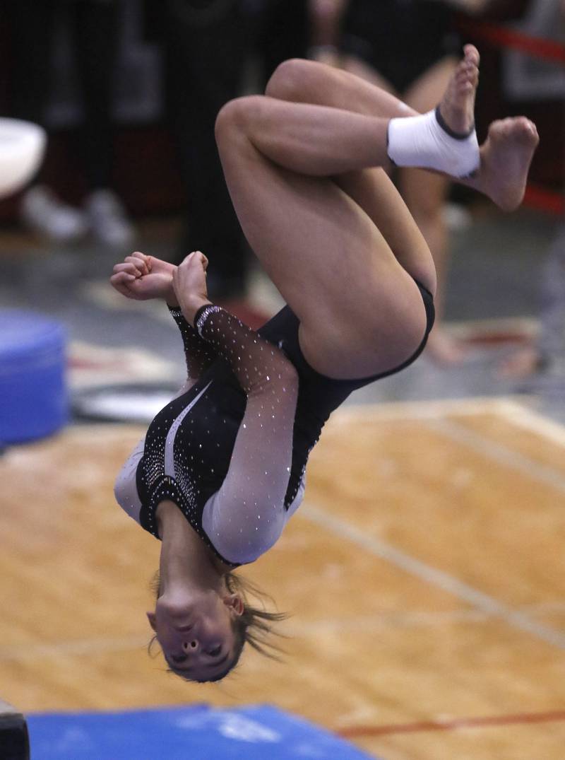 Lincolnway East's Flynn Meyer competes in the preliminary round of the balance beam on Friday, Feb. 21, 2025, during the IHSA Girls State Final Gymnastics Meet at Palatine High School.