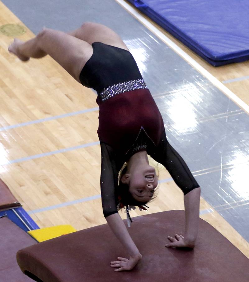 Prairie Ridge's Maria Kakish competes in the preliminary round of the vault Friday, Feb. 17, 2023, during the IHSA Girls State Final Gymnastics Meet at Palatine High School.