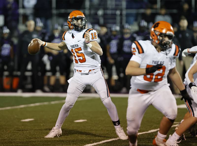 Wheaton Warrenville South's Luca Carbonaro (15) drops back to pass during the 7A first-round playoff game between Wheaton Warrenville South and Downers Grove North high schools on Friday, Nov. 1, 2024 in Downers Grove.