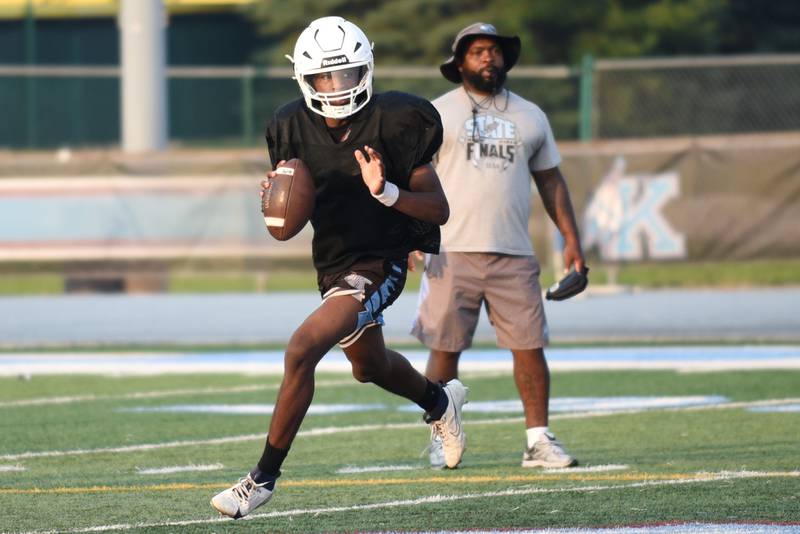 Kankakee's Phillip Turner rolls to his right during a team scrimmage at summer camp Thursday, July 31, 2025.
