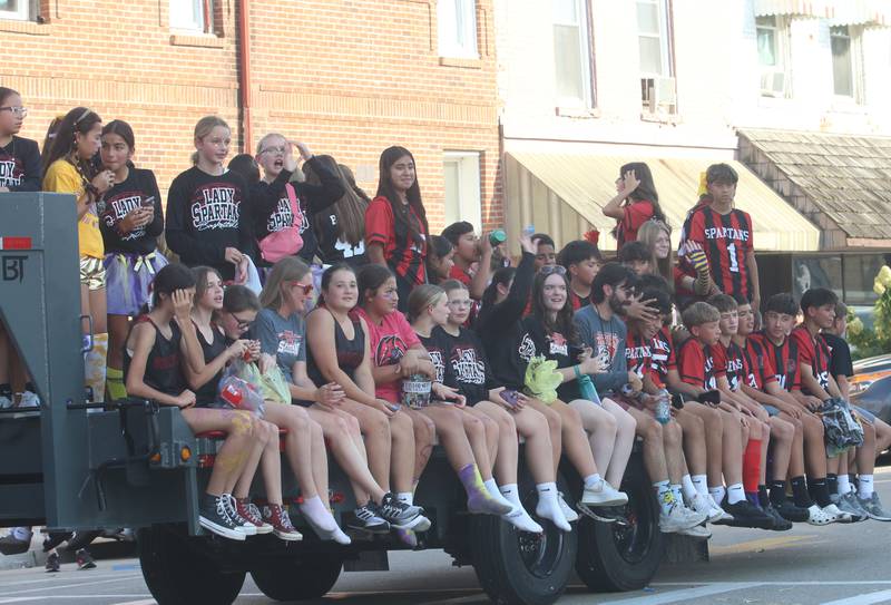 Mendota Northbrook Jr. High School students ride down Indiana Avenue during the homecoming parade on Friday, Oct. 3, 2025