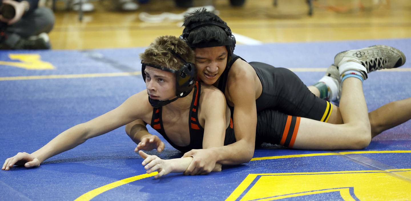 Jadiel Castillo of Glenbard North wrestles Jack Bashore of Wheaton Warrenville South at 113-pounds during the DuKane Conference boys wrestling tournament Saturday, Jan. 24, 2026 at Wheaton North High School in Wheaton.