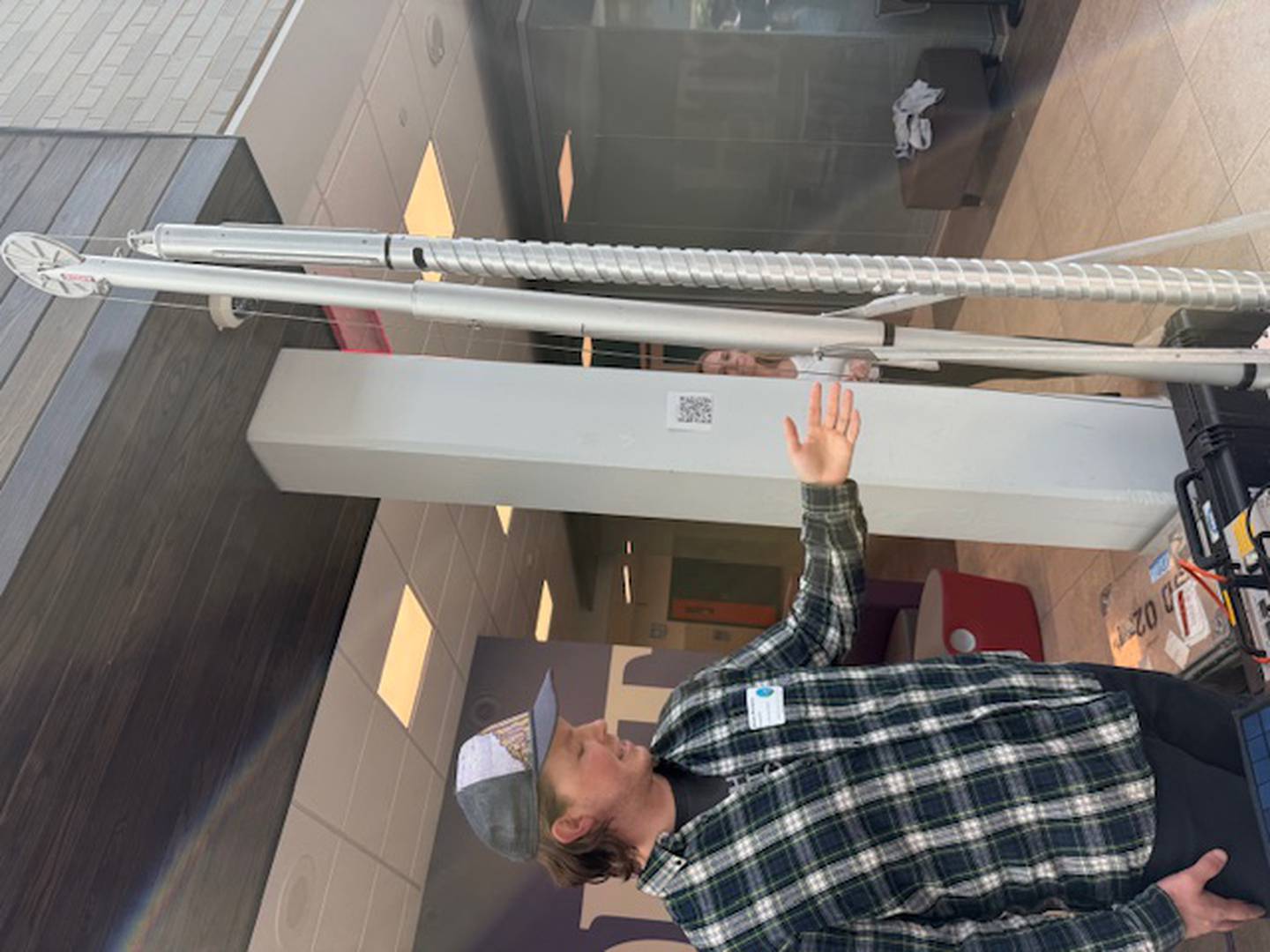 Elliot Moravec, who works with the U.S. National Science Foundation Ice Drilling
Program, explains the ice drill Friday at the 2026 Climate of HOPE Conference at Downers Grove North High School