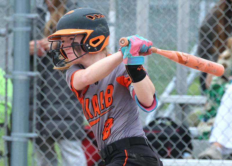 DeKalb's Cassidy Cavazos hits the ball towards left field Tuesday, May 19, 2026, during their Class 4A regional game against Harlem at DeKalb High School.