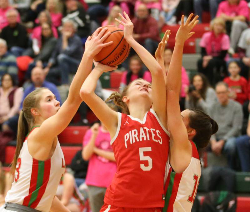 Ottawa's Grace Carroll is fouled by L-P's Bailey Pode while Olivia Shetterly tries to knock the ball free on Friday, Jan. 27, 2023 at L-P High School.