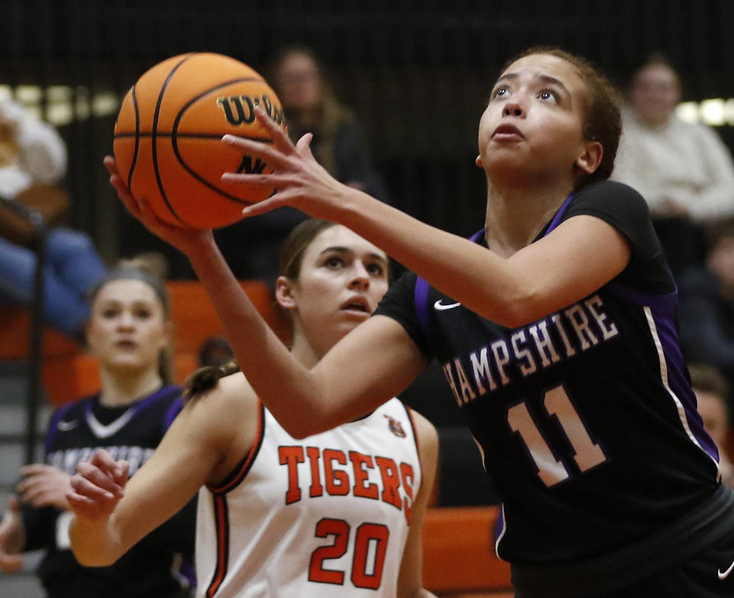 Hampshire's Mikala Amegasse shoots the ball in front of Crystal Lake Central's Hadley Ferrero during a Fox Valley Conference basketball game on Friday, Feb. 7, 2025, at Crystal Lake Central High School.