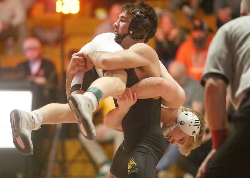 Yorkville Christian's Aiden Larsen wrestles Washington's Noah Woods in the 120 weight class during the Class 2A Sectional championship on Saturday, Feb. 15, 2025 at Washington High School.