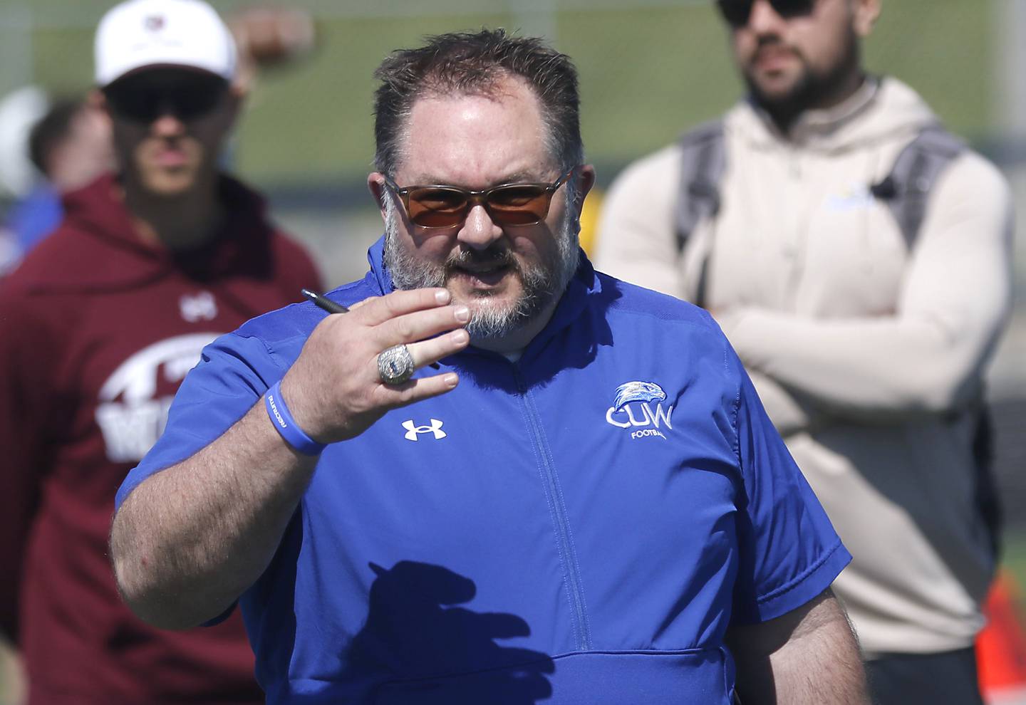 Concordia University Wisconsin offensive coordinator Curran White watches as players run drills  at the Northern Burbs Football Showcase on Monday, May 4, 2026, at Johnsburg High School. Over 165 players from 15 teams demonstrated their football skills to over 60 college coaches.