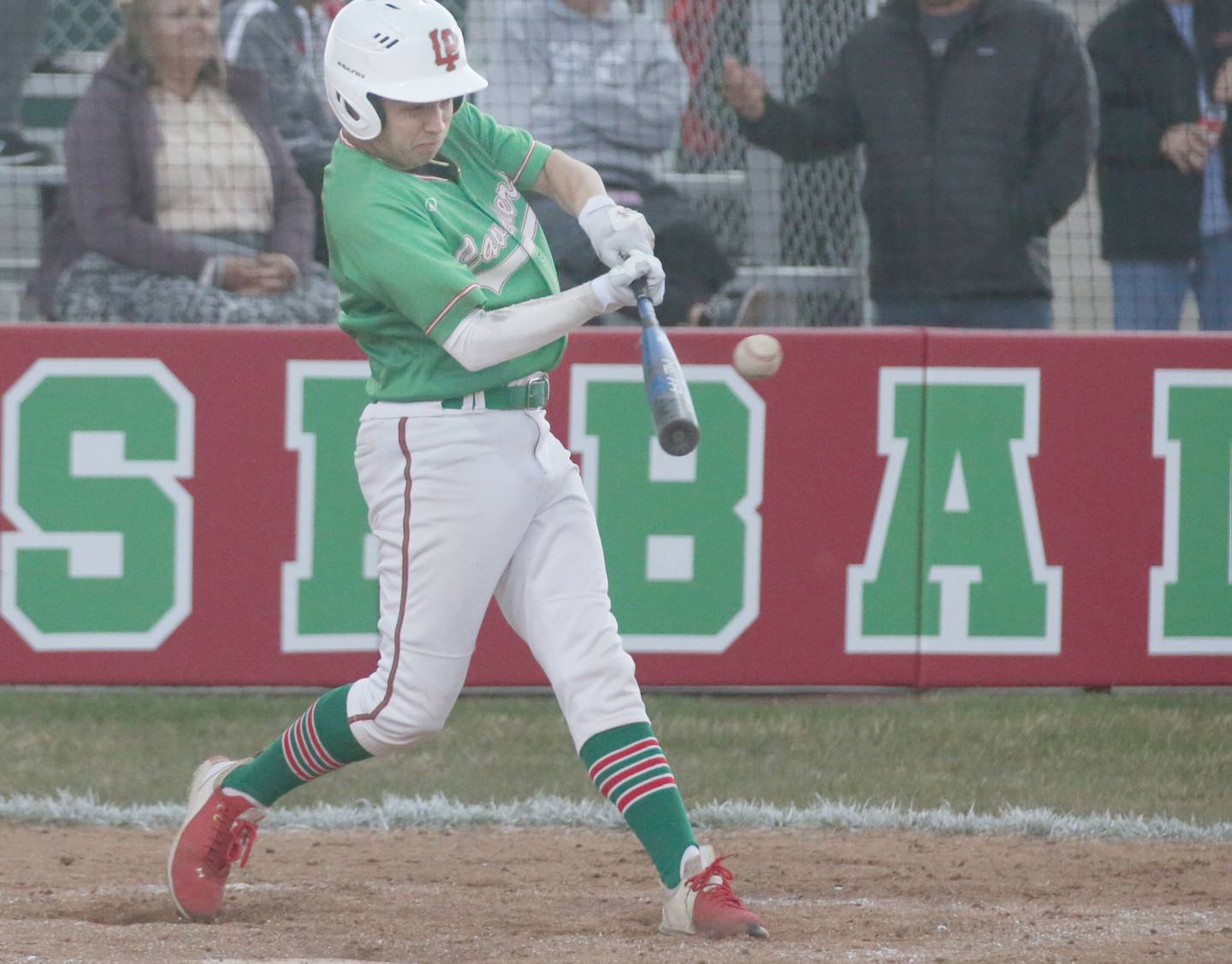 L-P's Alex Galindo smacks a double against Kaneland on Thursday, April 11, 2024 at Huby Sarver Field in La Salle.