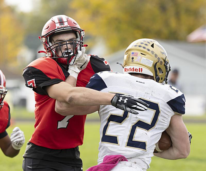 Amboy’s Troy Anderson looks to wrap up Hiawatha’s Lucas Norvell Saturday, Oct. 28, 2023 in the I8FA playoffs in Amboy.