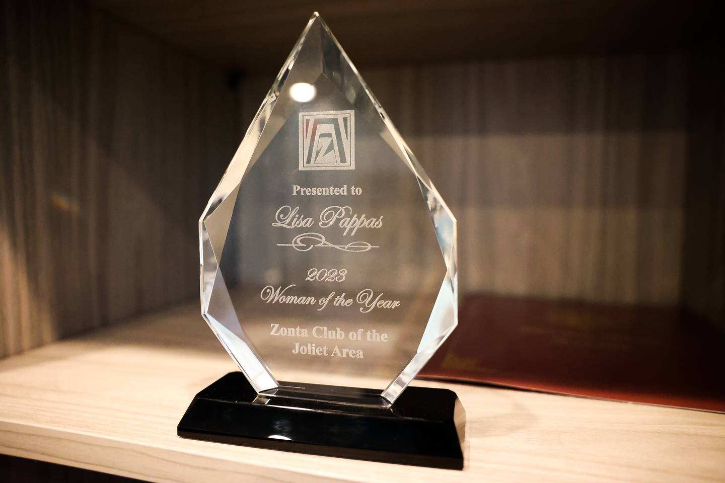 Lisa Pappas’ Zonta Club of the Joliet Area 2023 Woman of the Year award sits in her office at the Plainfield Public Library on Wednesday, June 7, 2023, in Plainfield.