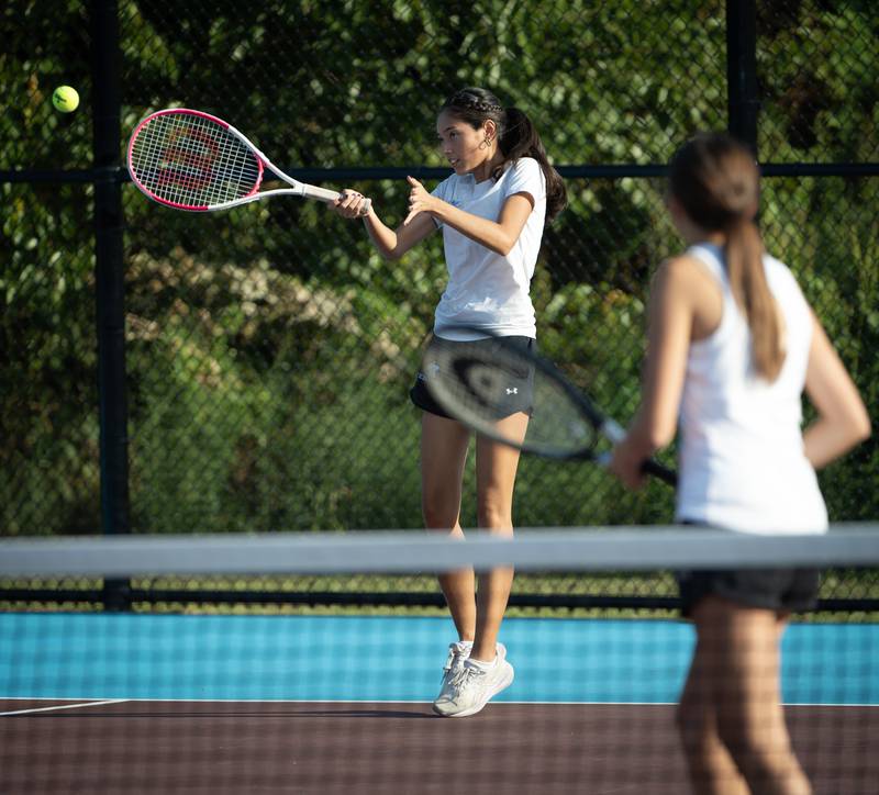 Kankakee's Mishelle Gaytan makes a return hit in a doubles match against Bradley-Bourbonnais on Wednesday, September 10, 2025.