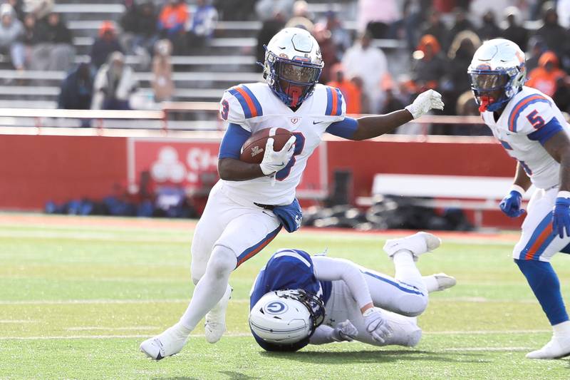 East St. Louis’ Christopher Bennett Jr. sheds a tackle on a run against Geneva in the Class 6A state championship on Saturday, Nov. 30, 2024 in Normal.