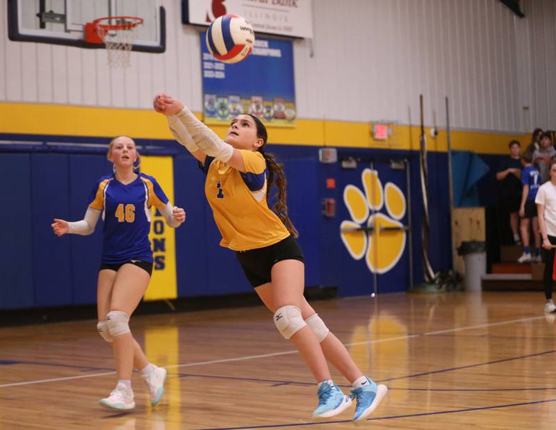 Logan's Gabby Sandoval returns a serve from Rockford-Marshall as teammate Breelyn Unthank looks on during the IESA Class 3A eighth-grade Regional final game on Thursday, March 13, 2025 at Logan Junior High School in Princeton.