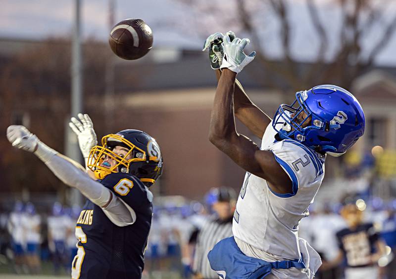 Sterling’s Jimmy Wadsworth tips the ball away rom the hands of St. Francis’ Ian Willis Saturday, Nov. 4, 2023 in a class 5A playoff game in Sterling.