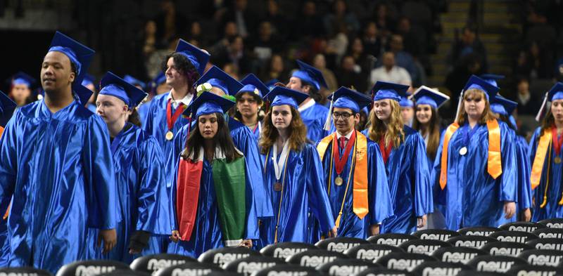 Dundee-Crown High School seniors enter the floor for the graduation ceremony on Saturday, May 21 at the Now Arena in Hoffman Estates.