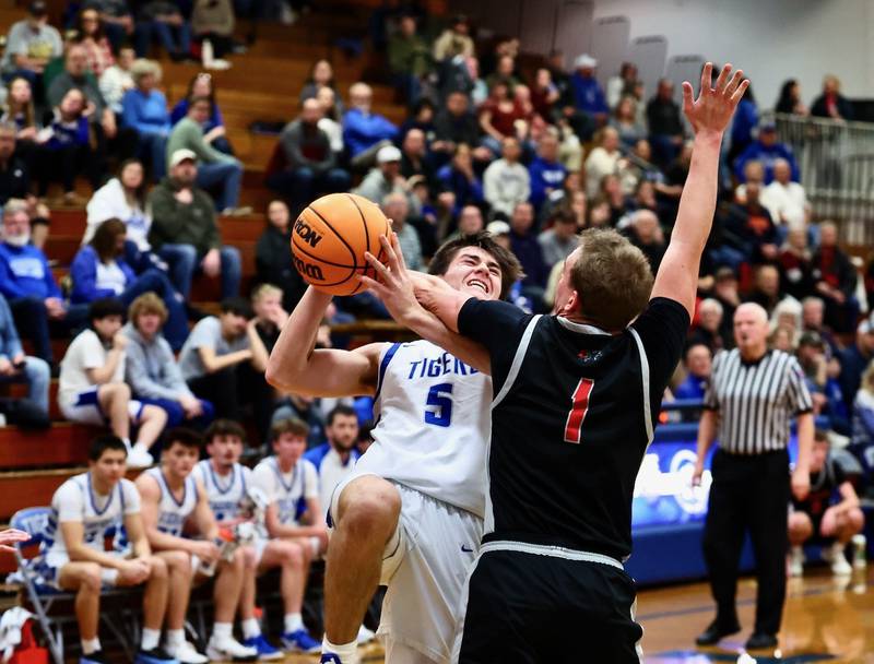Erie-Prophetstown's Keegan Winckler defends against Princeton senior Stihl Brokaw Tuesday night at Prouty Gym. The visiting Panthers won 54-46.