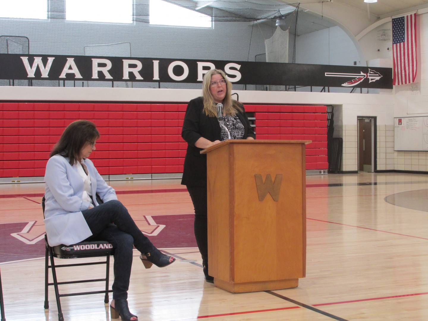 Woodland hall of fame inductee Kristine Metzke speaks to Woodland students Friday, April 14, 2023, in the school's gymnasium.