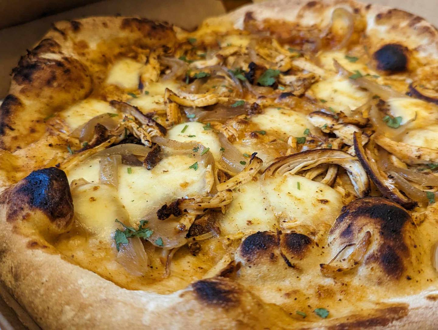 The Zep, a rustic pizza from Freedom Brothers Pizzeria & Alehouse in Plainfield, featured fresh mozzarella, slivers of pulled barbecue chicken, caramelized onions and cilantro. The flavor combinations married well.