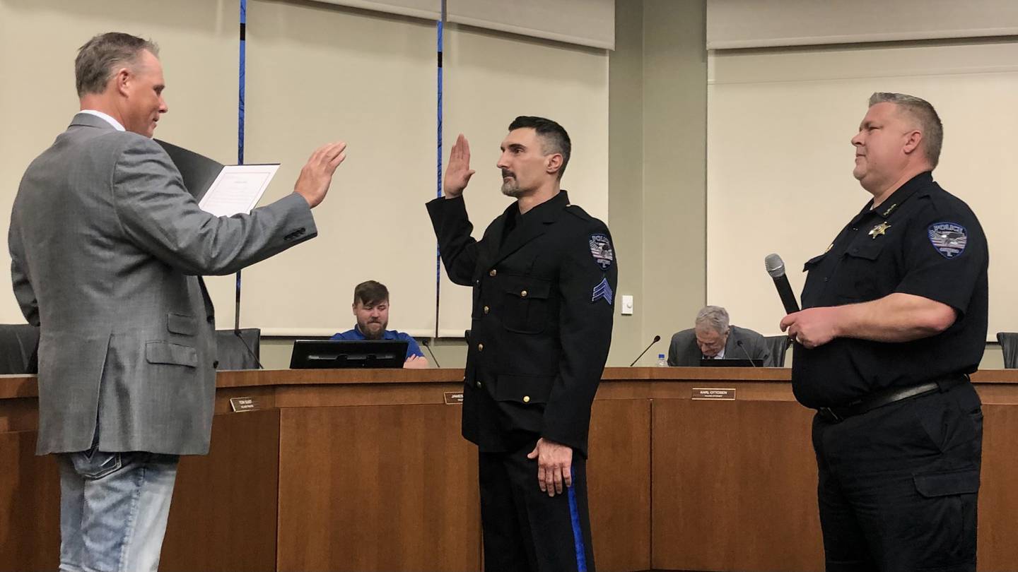 Frank Sterioti being sworn in by Troy Parlier at a village board meeting March 15.