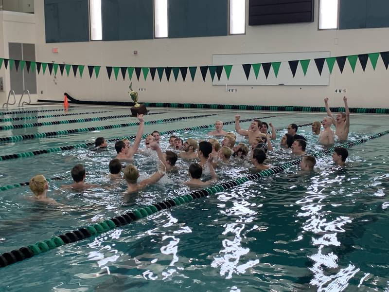Cary-Grove co-op's boys swimming team celebrates their Fox Valley Conference Invite championship on Saturday, Feb. 12, at Woodstock North High School in Woodstock.