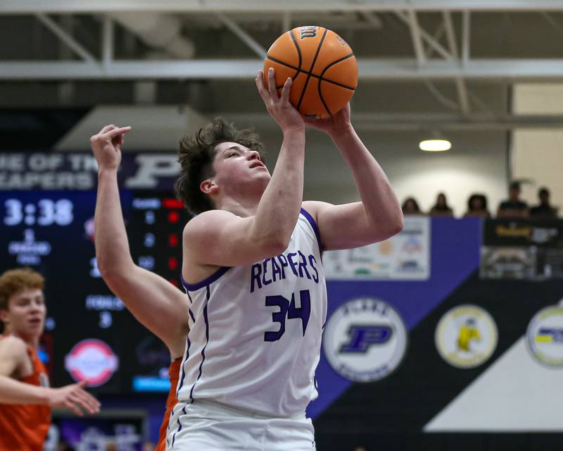 Plano's Kevin Martinez (34) goes up for a layup during their basketball game between Sandwich at Plano. Jan 27, 2025 in Plano.