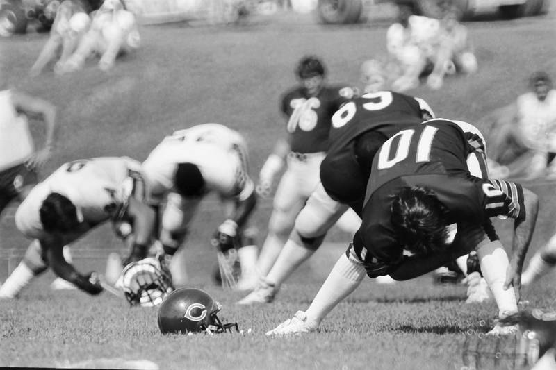 Chicago Bears kicker Bruce Kallmeyer (10) and other players stretch during training camp on Wednesday, June 12, 1985 in Platteville Wis.
