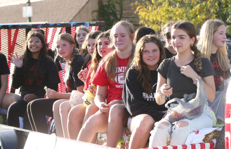 Members of the Hall High School volleyball team ride a float during the Homecoming parade on Thursday, Sept. 28, 2023 in Spring Valley.