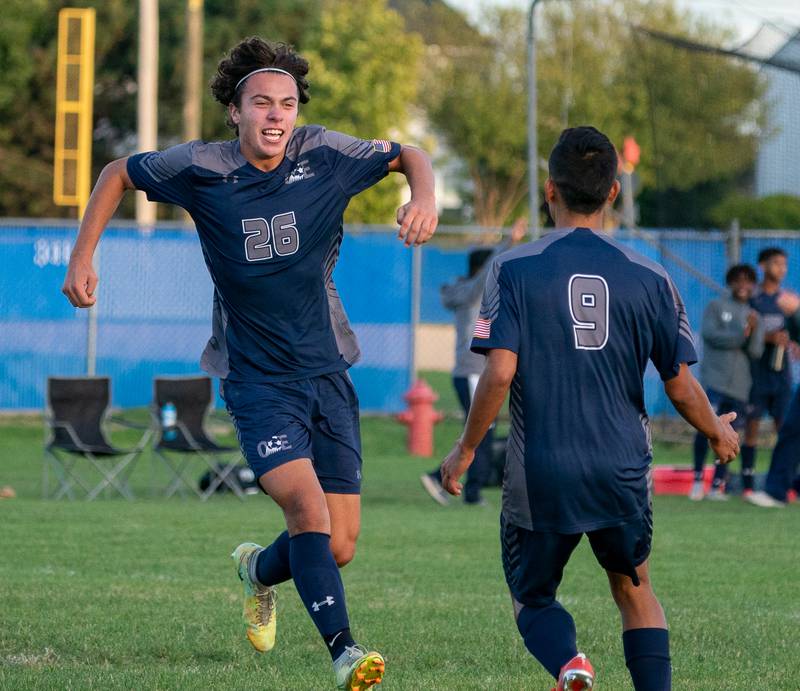 Oswego East's Josh Lopez (26) reacts after scoring a goal against Oswego during a soccer match at Oswego East High School on Monday, Sep 26, 2022.