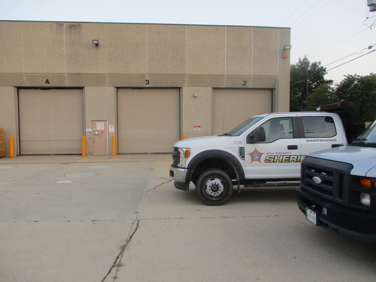 A Will County Sheriff's vehicle is parked outside the former Pace bus garage in Joliet, which is now owned by the county. Aug. 5, 2025.
