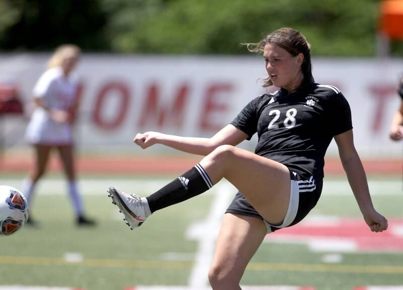 Fenwick’s Grace Kapsch (28) kicks the ball during an IHSA Class 2A state semifinal game against Triad at North Central College in Naperville on Friday, June 3, 2022.