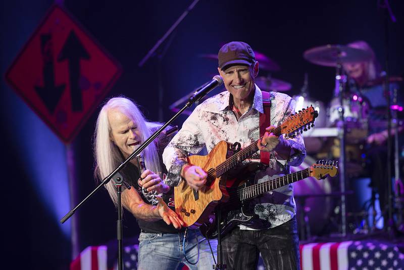 Darren Walker (left) and Mark Murtha of Head East interact on stage Saturday, April 22, 2023 at the Dixon Historic Theatre.