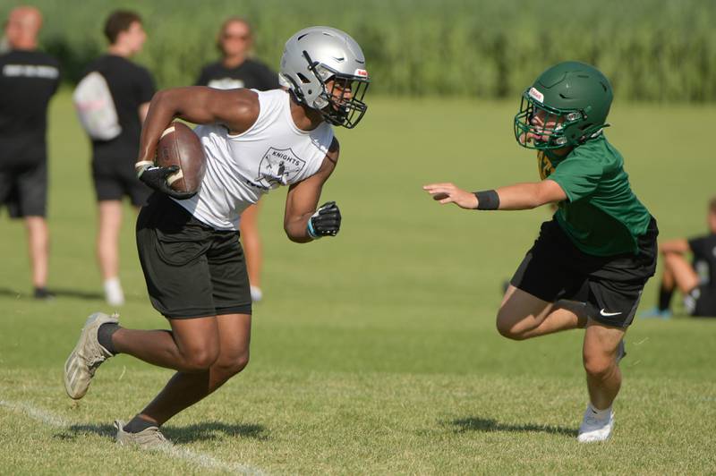 Kaneland offense runs with the ball against Crystal Lake South during a 7 on 7 football in Maple Park on Tuesday, July 12, 2022.